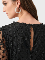 Elegant black wide leg jumpsuit, designed for comfort and style with a flowing silhouette.