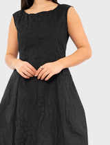Stylish black poplin dress with an eye-catching print, ideal for adding flair to any wardrobe.