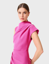 A pink midi dress featuring an asymmetrical cut, presented on a model, illustrating its fashionable appeal.