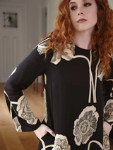 Black "Charge It To My Room" dress, offering a modern look for both casual and formal settings.
