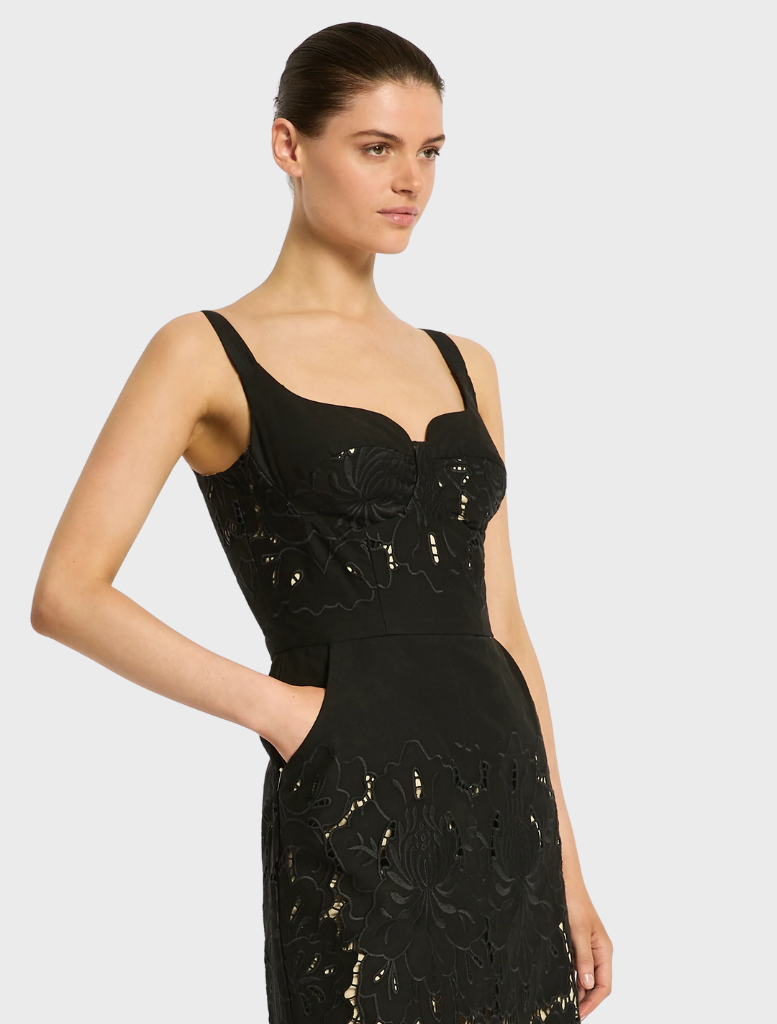 Chic black Colette dress designed with a flattering shape and subtle embellishments, perfect for elegant outings.