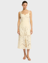 The Colette Dress in Buttermilk, characterized by its chic design and comfortable fit, ideal for day or evening outings.