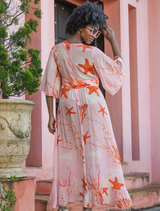 Eye-catching pink shell dress featuring a dynamic fire motif, perfect for adding flair to your wardrobe.