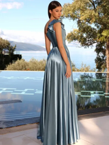 Cadet blue gown draped elegantly, illustrating its soft fabric and sophisticated style.