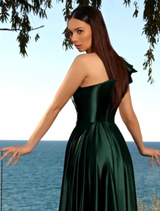 Full view of a deep emerald gown, illustrating its graceful lines and opulent hue.