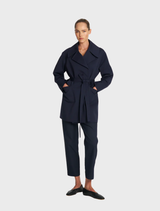 An elegant ink-colored wrap trench coat with a tie belt and a sophisticated collar, ideal for both casual and formal occasions.
