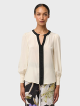 Sophisticated cloud silk blouse with pleated cuffs, ideal for adding a touch of elegance to any outfit.