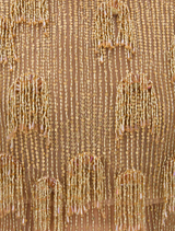 Gold Lani gown hanging on a rack, featuring a sleek silhouette and delicate embellishments for a sophisticated look.