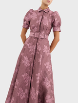 Annette Button Gown in a soft Moonlight Mauve, featuring a refined design with buttons and a flattering, flowing shape.