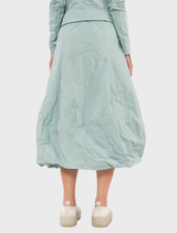 Stylish mint poplin skirt with an eye-catching print, ideal for casual or semi-formal events.