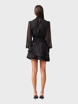Chic black Moss Mini Dress designed with a modern cut, perfect for dressing up or down for any occasion.