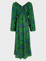 Elegant green floral dress with puff sleeves and a cinched waist, ideal for outdoor events or casual gatherings.