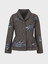A gravel Seam A Little Seam Jacket, highlighting its sleek design and fabric texture, is presented on a hanger.