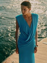 Stunning aquamarine Solstice Gown featuring a graceful silhouette and delicate embellishments, ideal for special events.
