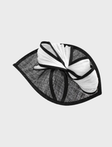 Fashionable black and white Xanthia fascinator adorned with unique accents, perfect for adding flair to any formal outfit.