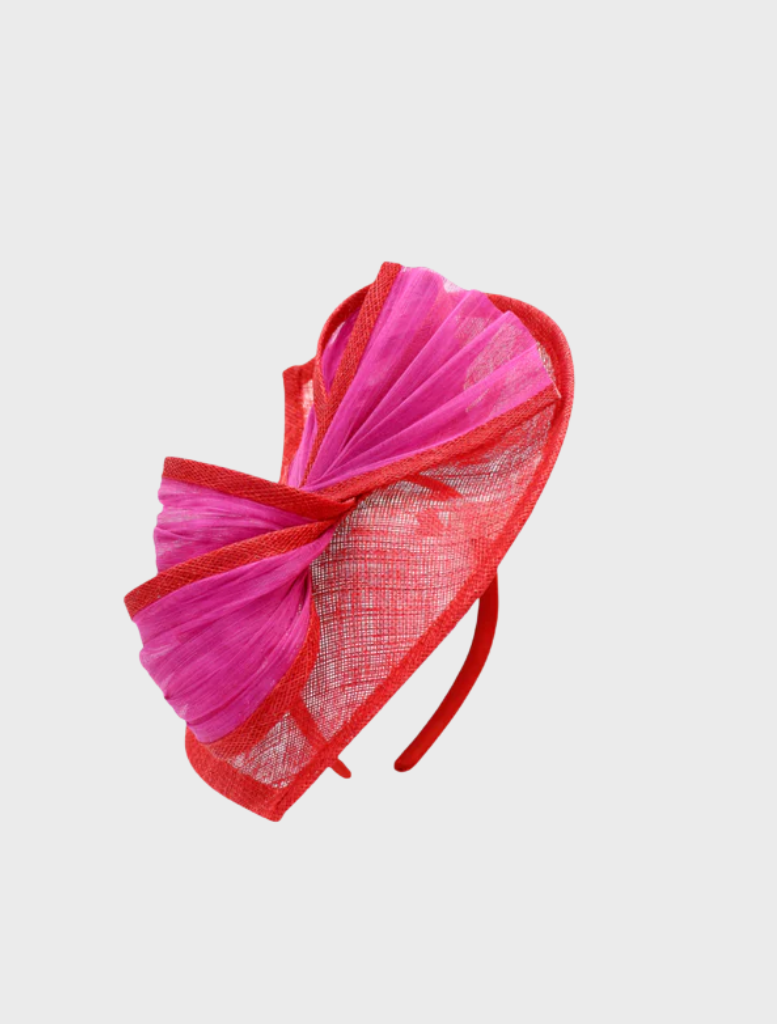 Chic red and pink fascinator with intricate floral design, a fashionable accessory for special events.