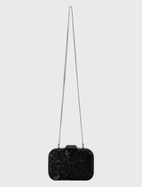 Black ELENA clutch with sequined design, removable chain, and clasp closure, ideal for carrying essentials on a night out.