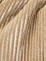 Pleated champagne purse with a curved handle, magnetic fastening, and an internal slip pocket suitable for smartphone storage.