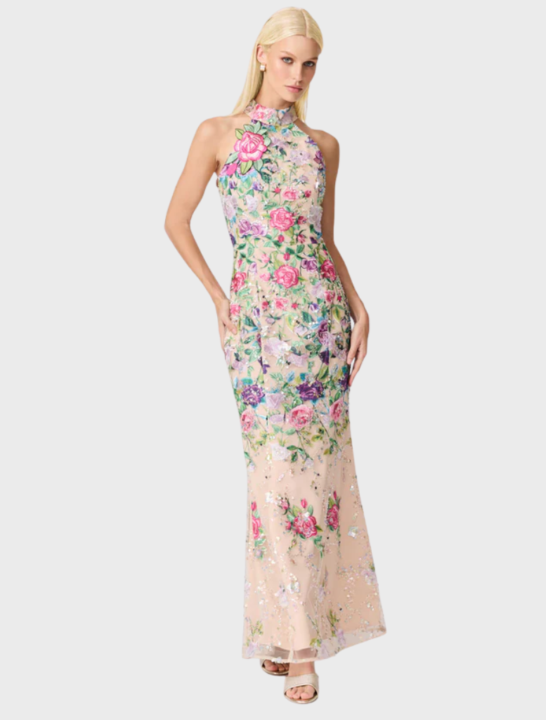A stylish floral gown made from a delicate floral print fabric, emphasizing its beautiful patterns and colors.
