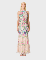 A floral gown featuring a vibrant floral print fabric, showcasing a blend of colors and patterns.