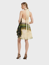 Serene pink halterneck mini dress displayed on a mannequin, showcasing its elegant design and soft color.