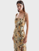 Luxurious gold Elyse gown showcasing delicate embellishments and a flattering design for evening wear.