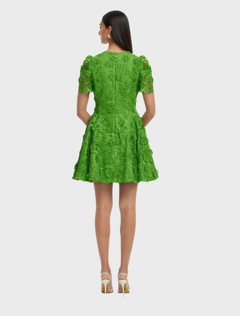 A green dress with a detailed floral pattern, presenting a fresh and stylish look suitable for various occasions.