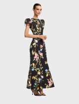 Maxi dress with embellished puff sleeves, displaying a vibrant lemon vine print on a rich ebony background.