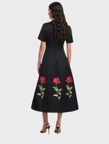 Caroline Embellished Rose Midi Dress in ebony, showcasing beautiful rose accents for a refined and stylish appearance.