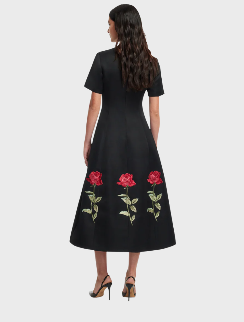 Caroline Embellished Rose Midi Dress in ebony, showcasing beautiful rose accents for a refined and stylish appearance.