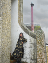 Stylish Loom With A View dress in black and gold, featuring a graceful silhouette suitable for formal occasions.