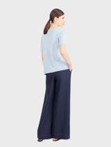 Sky blue knitted pullover with short sleeves and colorful floral embroidery, made from soft, luxurious pure viscose.