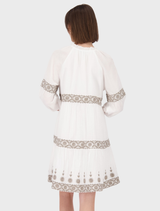 Round neck dress in cream, highlighted by exquisite embroidery that enhances its overall design.