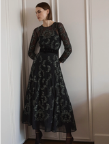 Elegant emerald and black A-line dress, showcasing a classic silhouette perfect for formal events or casual outings.