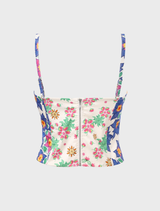 A colorful bustier combining hand-drawn florals and geometric patterns, highlighted by a vibrant lotus design in the center.