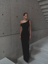 Sophisticated black Emile gown laid flat, illustrating its elegant shape and high-quality material for formal events.
