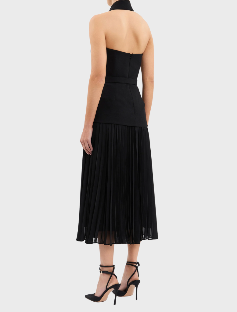  A fashionable black and white dress complemented by a white collar.