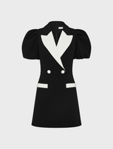 A stylish black and white dress featuring a puff sleeve design.