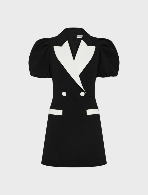 A stylish black and white dress featuring a puff sleeve design.