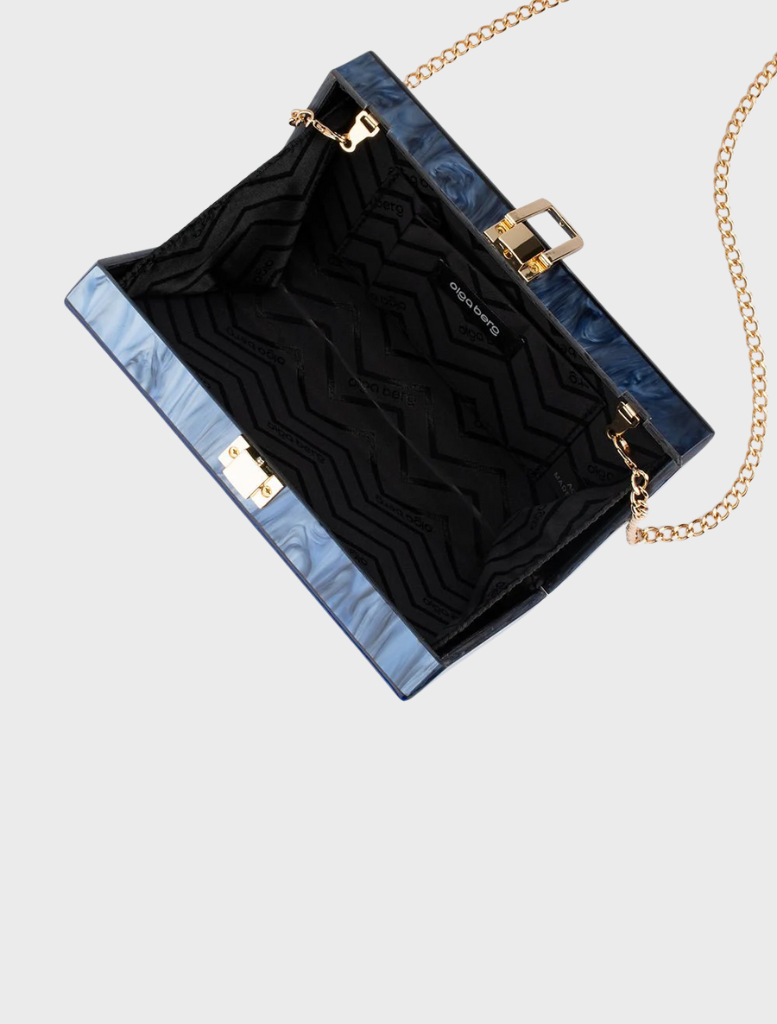 A fashionable blue and white purse with a chain strap, suitable for various styles and events.
