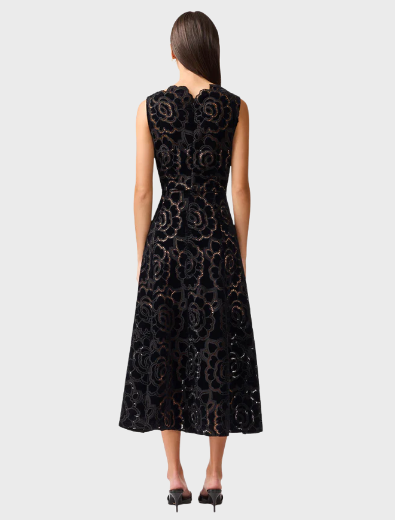 Elegant black lace dress, ideal for a stylish night out, showcasing intricate detailing and a flattering silhouette.
