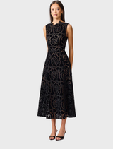  Fashionable black lace dress, perfect for a night out, combining elegance with a modern touch for a striking look.