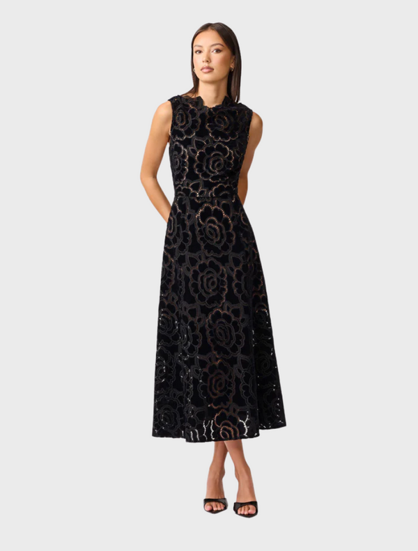Chic black lace dress, perfect for an evening outing, featuring delicate lace patterns and a sophisticated design.