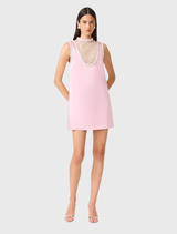Stylish rose pink mini dress with a collared neckline and delicate pearl details, designed for versatile occasion wear.