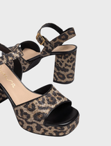 Contemporary leather sandal with a sturdy wide heel, ideal for both casual and dressy occasions.