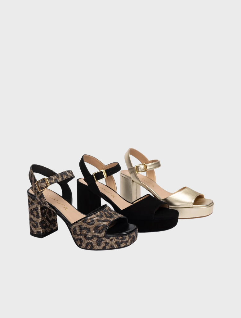 Fashionable leather sandal featuring a wide heel, offering support and style for all-day wear.