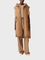 Brown jacket displayed on a hanger, showcasing its sleek design and fabric texture.
