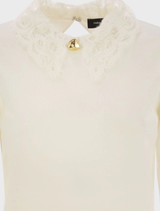 Delicate white macrame lace knit fabric, showcasing a beautiful lace pattern suitable for fashion or home decor.