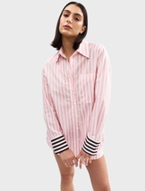 A Buddy Shirt adorned with a vibrant fairy stripe design, showcasing a blend of soft colors for a cheerful appearance.