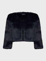 Close-up of a black fur bolero, focusing on the rich texture and chic design details.